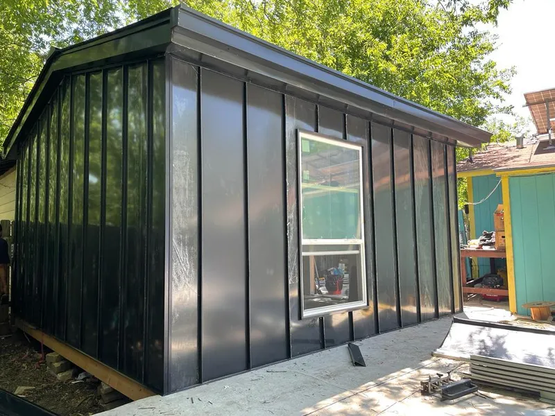 Black standing seam metal wall panels for Roof Inspection in Harahan