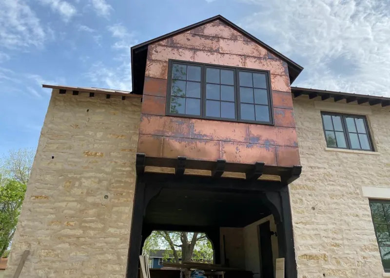 Copper metal panel facade on a stone building for Metal Roof Coating in Harahan