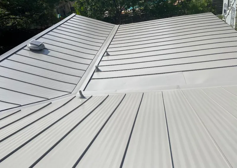 Solar attic fan installed on a metal roof for Roof Ventilation in Harahan